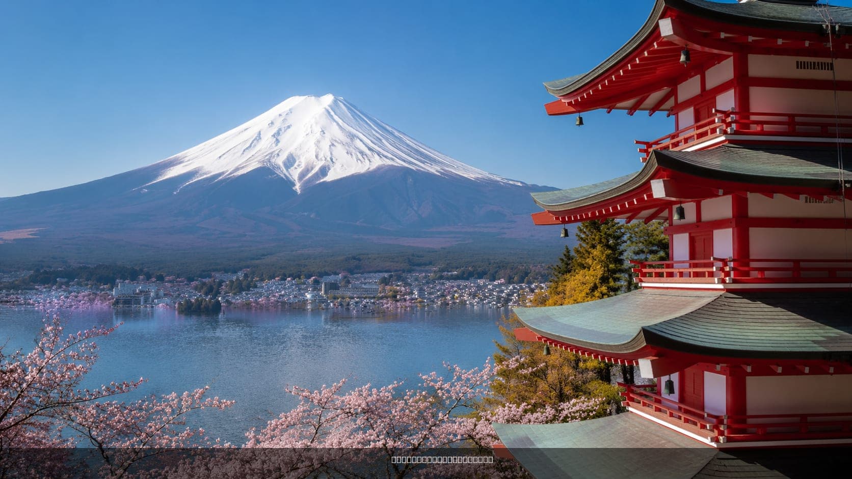 View of Mount Fuji with a clear sky and reflection on a lake, 2026.
