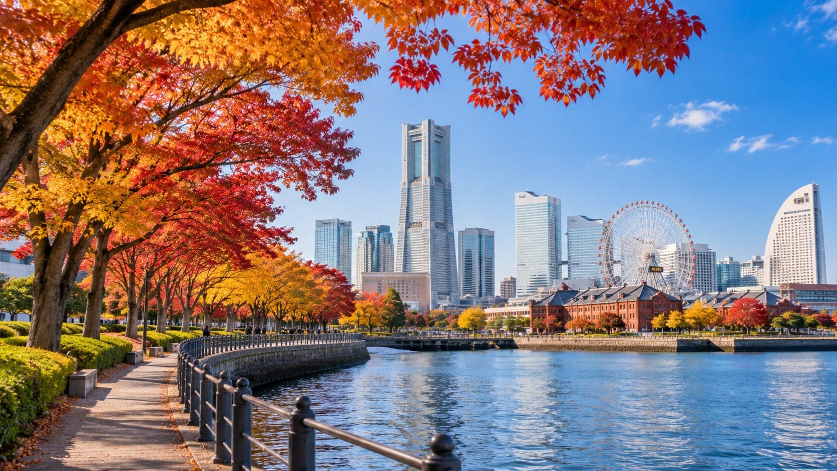 Yokohama Minato Mirai skyline with autumn leaves framing the harbor and Landmark Tower