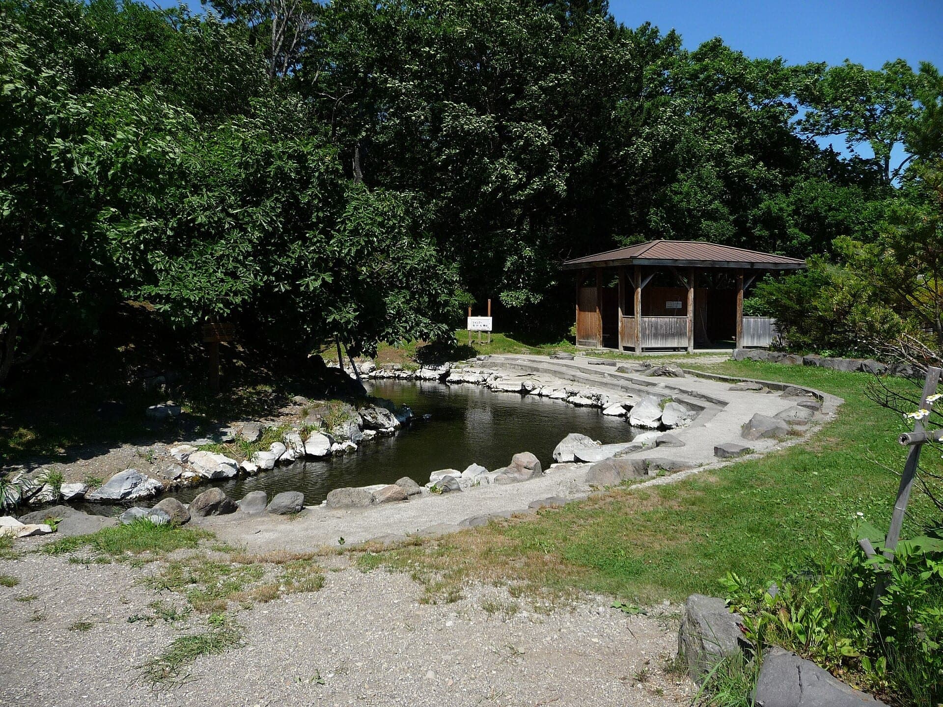 Outdoor onsen bath with steam at Wakoto hot spring, Hokkaido