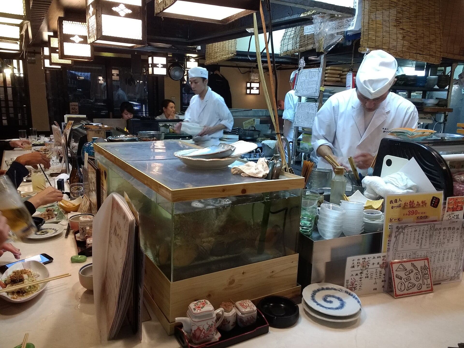 Chefs and diners at the counter of Gion Kappa, a casual restaurant in Kyoto