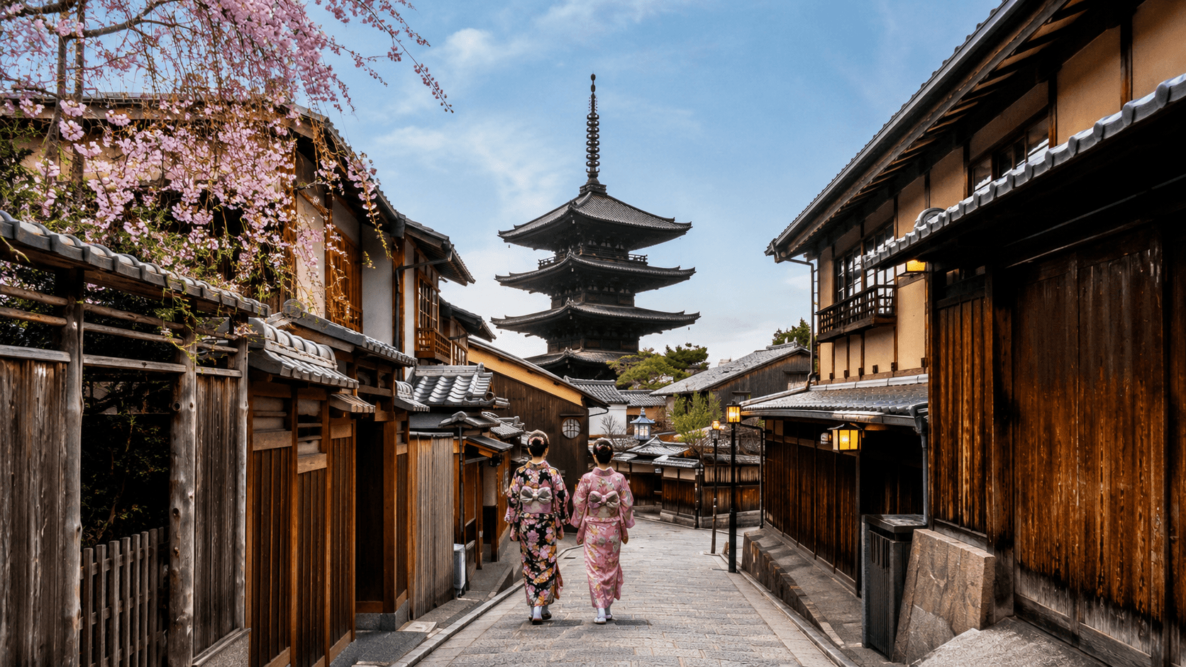 Women in kimonos walking towards Yasaka Pagoda in Kyoto Japan